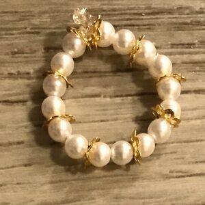 Pearly white ring with gold beads on the sides